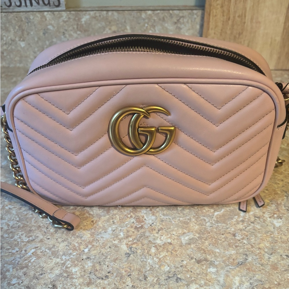 Authentic Gucci Camera bag, light pink with gold GG and long strap.